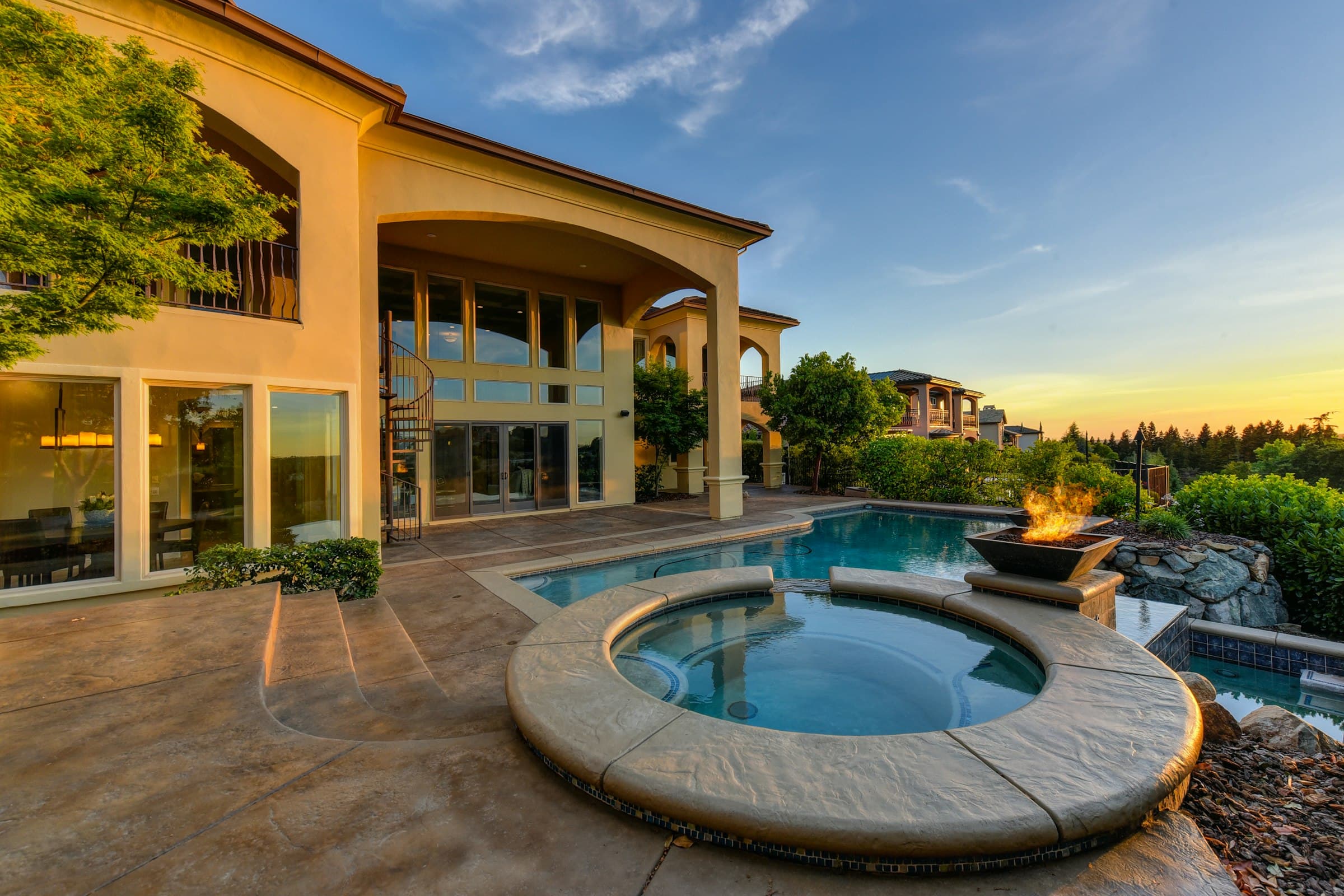 Mediterranean villa with spa pool at sunset